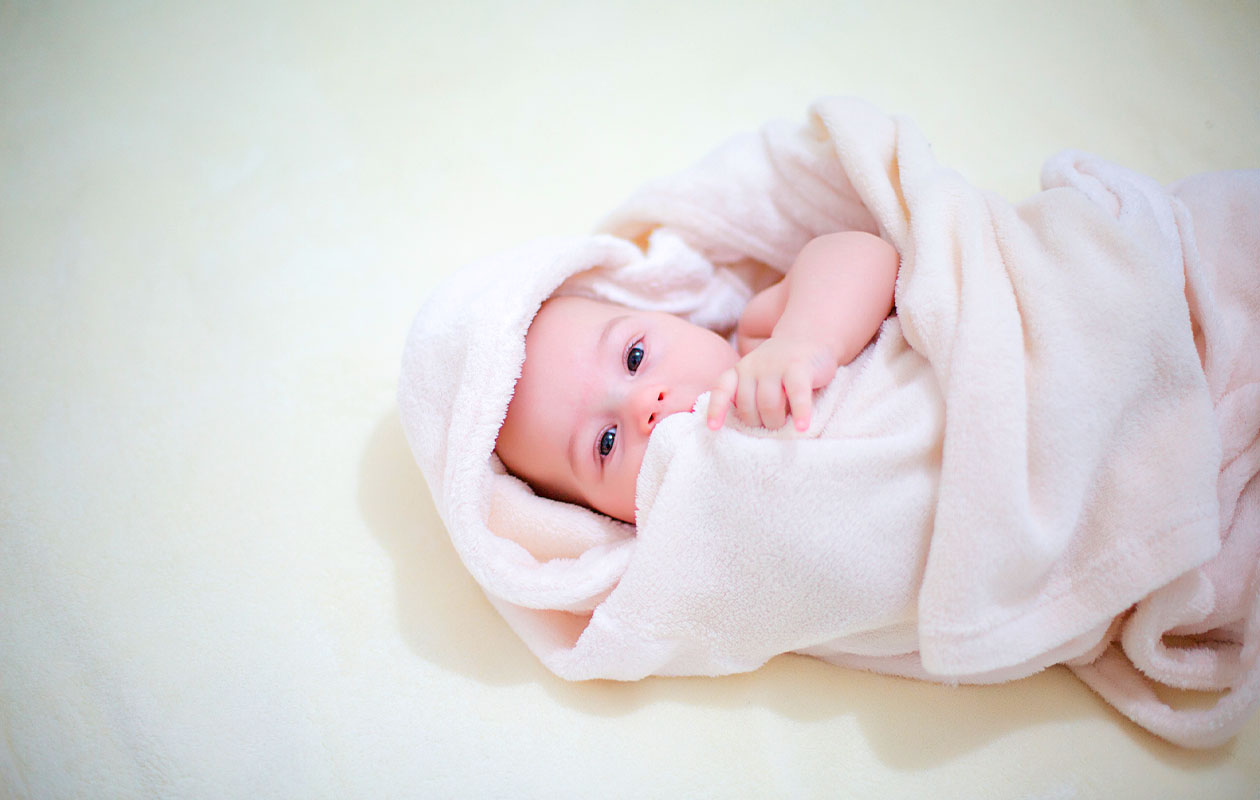 Zwangerschap/newborn fotoshoot bij een fotostudio naar keuze