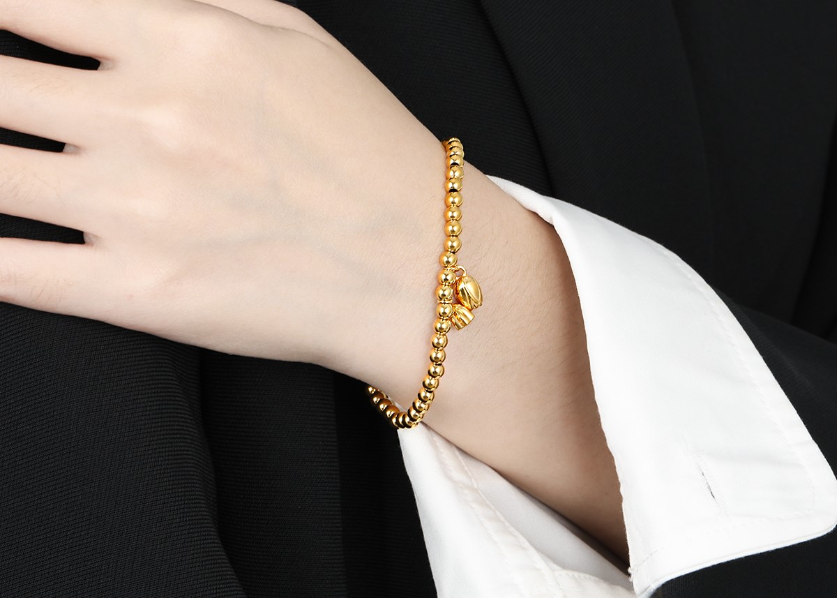 Bracelet Doré avec Boules et 2 Pendentifs