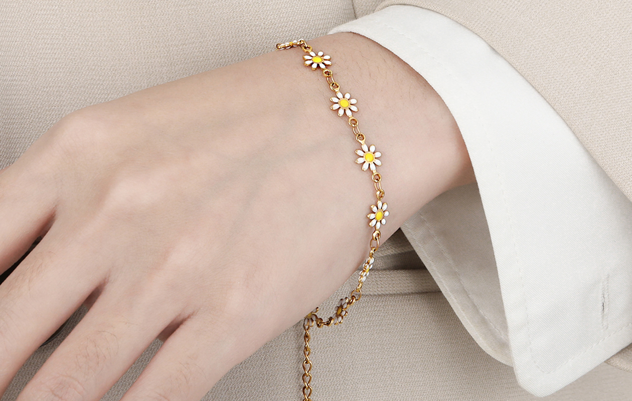 Charmante gouden armband met bloemen design
